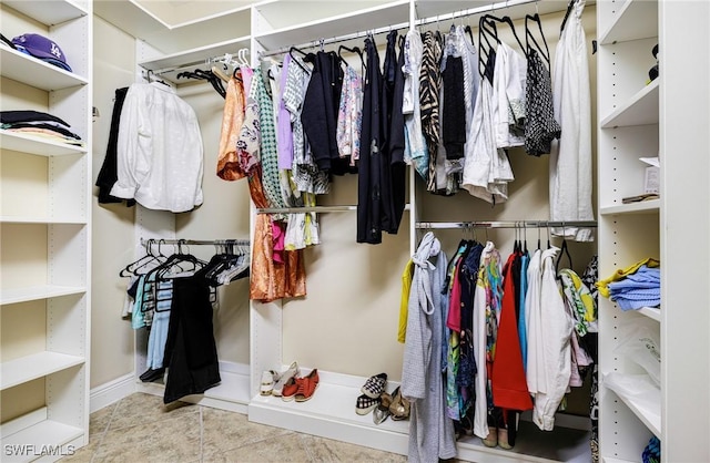 walk in closet featuring light tile patterned floors