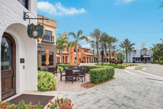 view of property's community with a patio area and a residential view