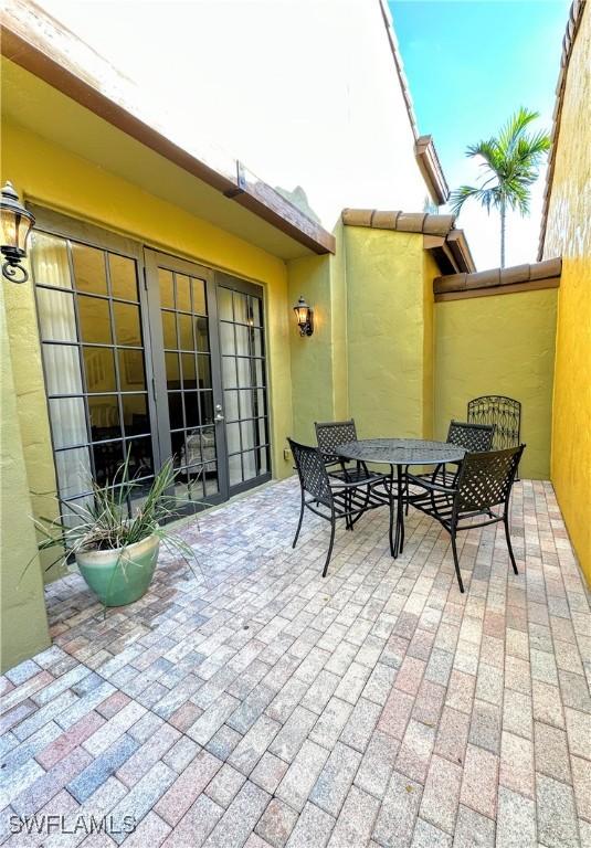 view of patio / terrace featuring french doors and outdoor dining space