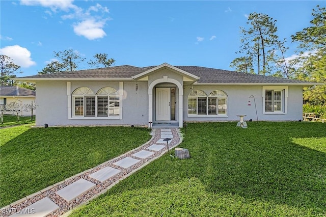 ranch-style house with a front yard and stucco siding