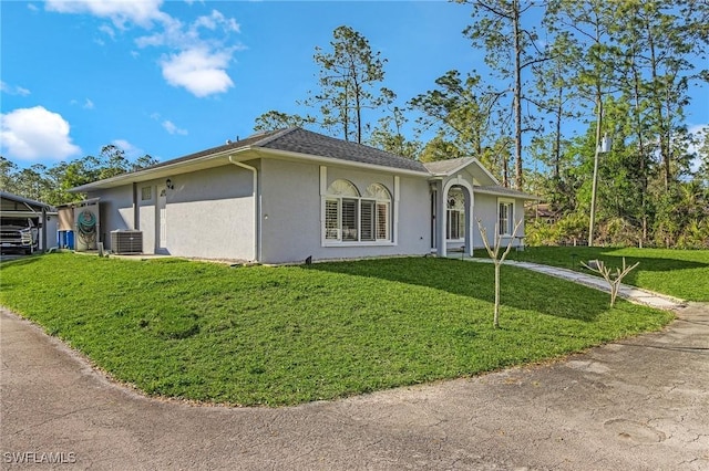 view of front of home featuring central AC unit, a front lawn, and stucco siding