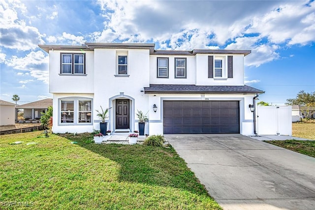 view of front of property with a front lawn and a garage