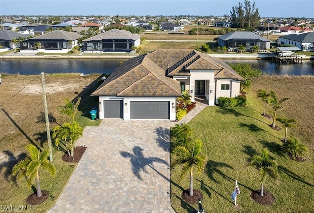 view of front of house with a water view and a garage