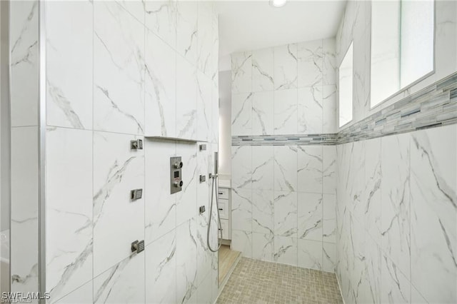 full bath featuring a tile shower