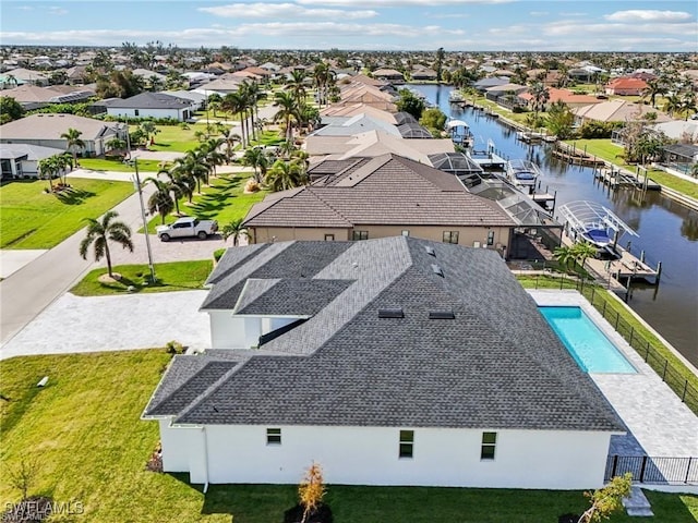 bird's eye view with a water view and a residential view