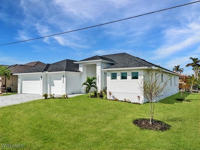 view of front of property with concrete driveway, a front lawn, an attached garage, and stucco siding