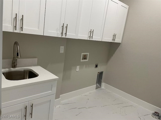 washroom with washer hookup, marble finish floor, a sink, cabinet space, and hookup for an electric dryer