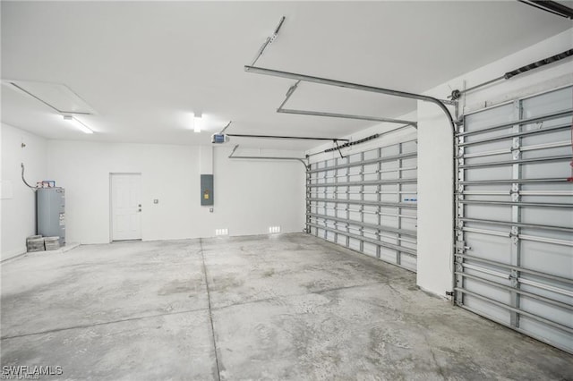 garage featuring electric panel, electric water heater, and a garage door opener