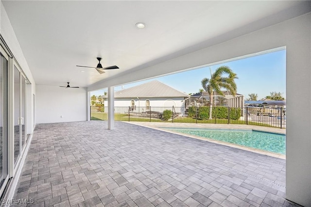 view of pool featuring ceiling fan, a fenced in pool, fence, and a patio