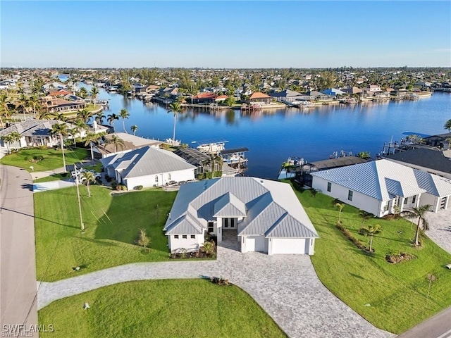 bird's eye view featuring a residential view and a water view