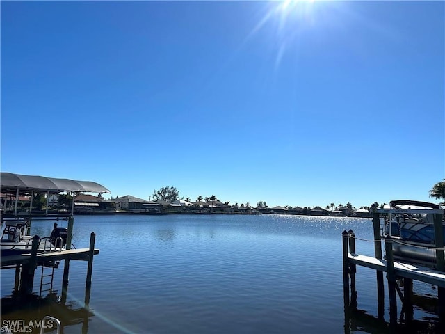 dock area featuring a water view and boat lift