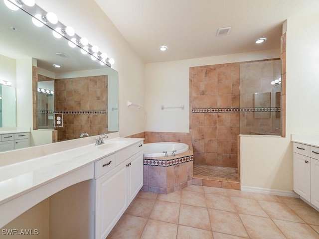 full bath with visible vents, tile patterned flooring, walk in shower, vanity, and a bath