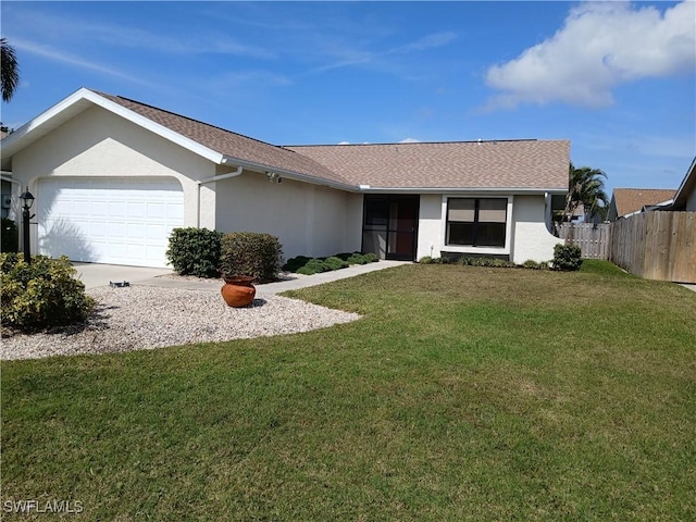 ranch-style home featuring a garage and a front lawn