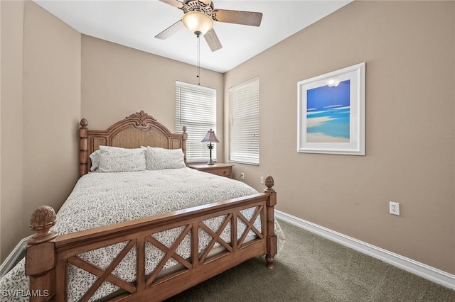 bedroom with ceiling fan, carpet flooring, and baseboards