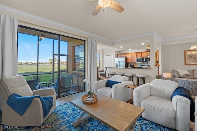 living room with ceiling fan and crown molding