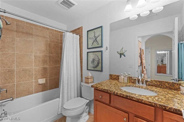 full bathroom featuring shower / bath combo, visible vents, toilet, tile patterned floors, and vanity