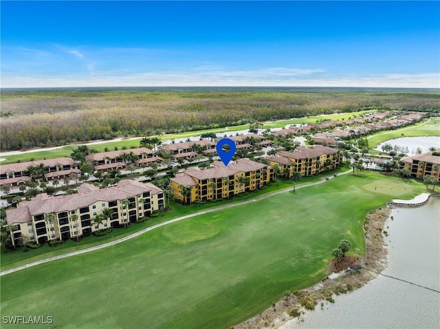 bird's eye view with view of golf course and a water view