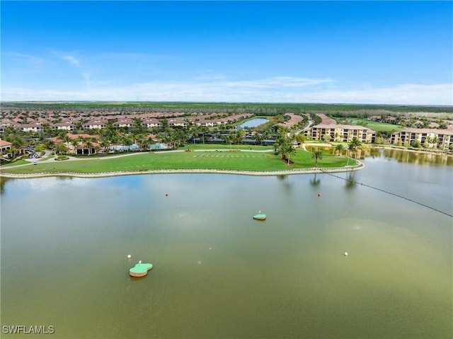 drone / aerial view with a water view and a residential view