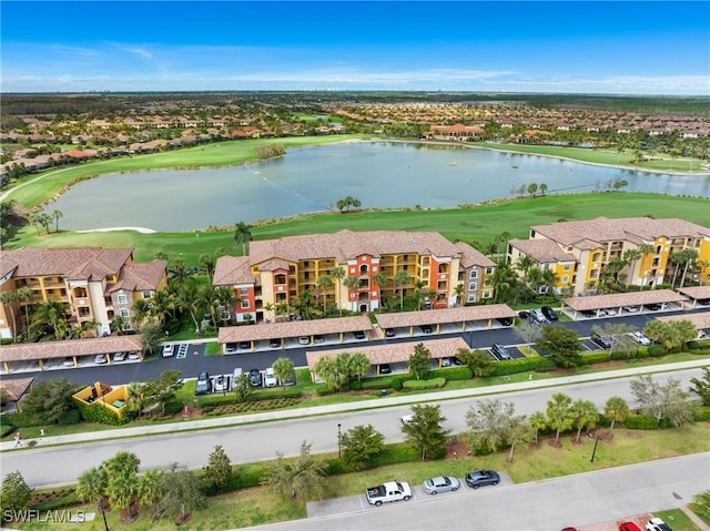 birds eye view of property with a water view and a residential view