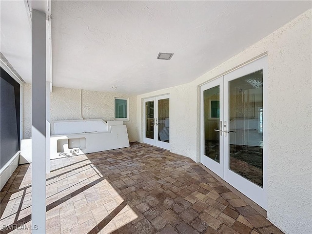 view of patio featuring french doors