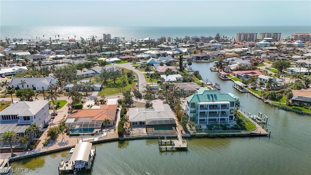 aerial view with a residential view and a water view