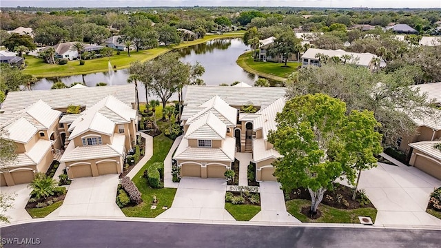 bird's eye view with a water view and a residential view