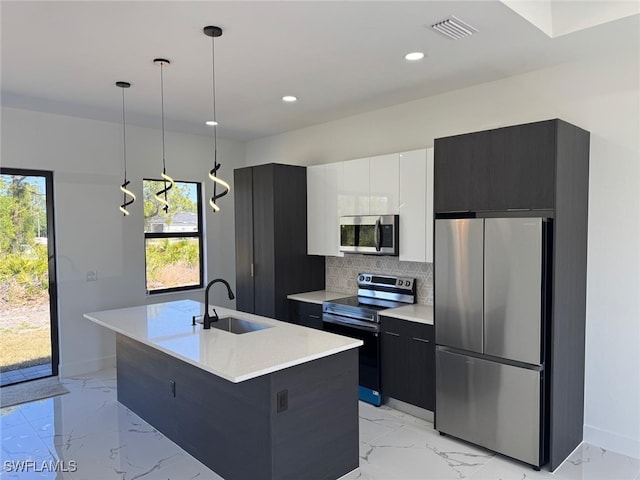 kitchen featuring visible vents, a sink, appliances with stainless steel finishes, modern cabinets, and marble finish floor