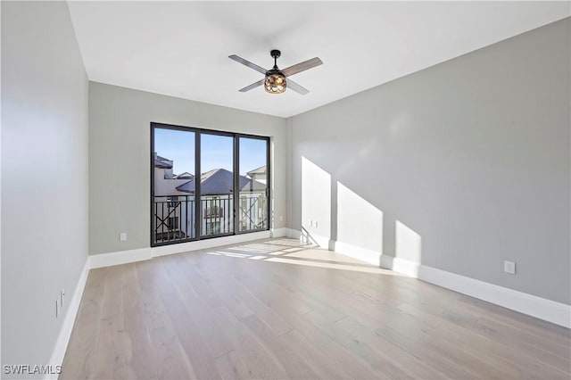 unfurnished room featuring light wood-type flooring and ceiling fan