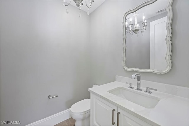 bathroom with toilet and vanity