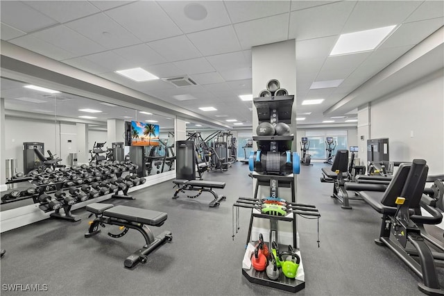 exercise room featuring a drop ceiling