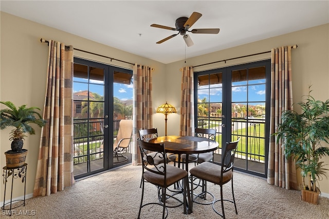 dining area with baseboards, light colored carpet, and french doors