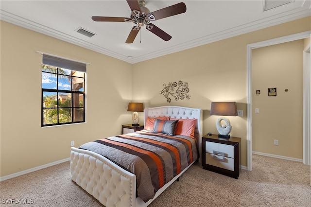 bedroom featuring crown molding, baseboards, visible vents, and light colored carpet