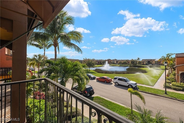 balcony featuring a water view