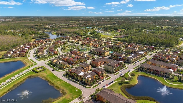 birds eye view of property featuring a water view and a residential view