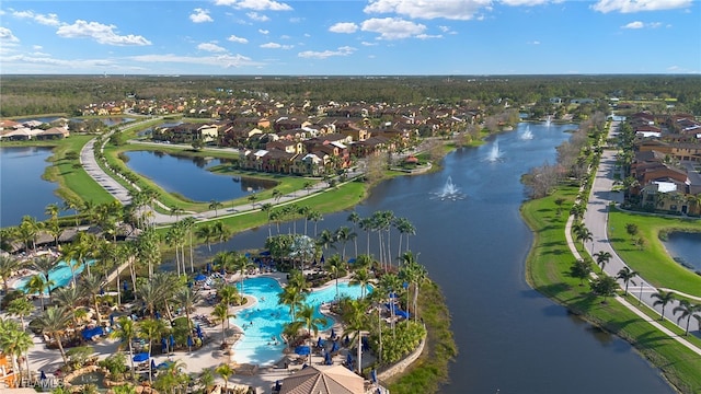 birds eye view of property with a water view and a residential view