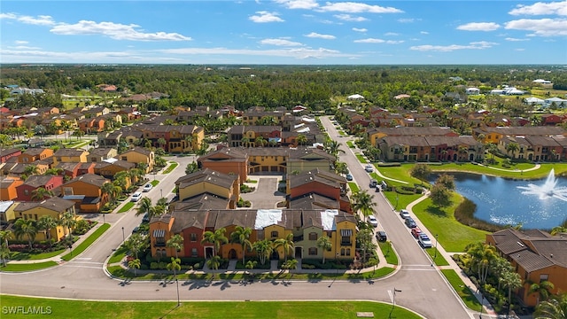 bird's eye view featuring a residential view and a water view