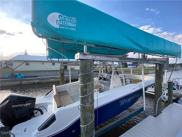 view of dock with a water view and boat lift