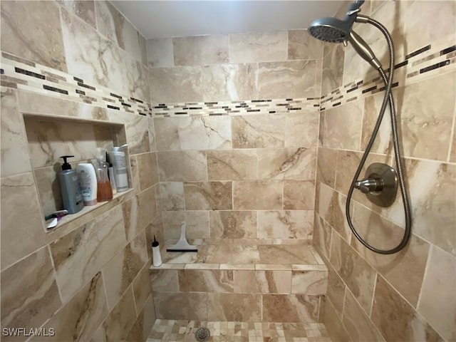full bath with tiled shower
