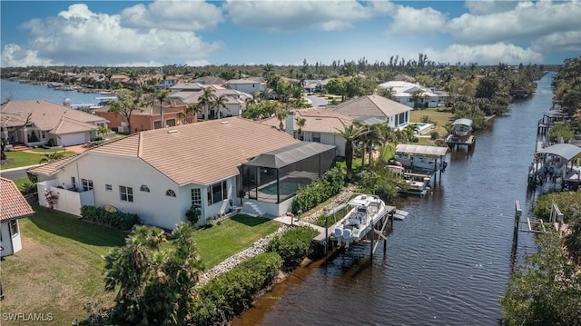 aerial view with a water view and a residential view