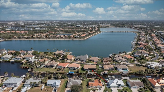 aerial view featuring a water view and a residential view
