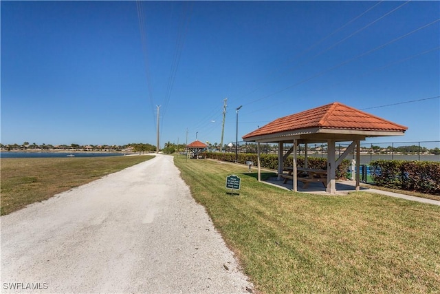 view of property's community featuring a yard and a gazebo