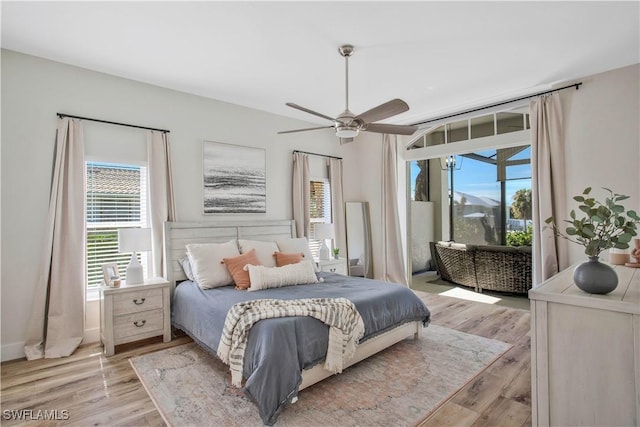 bedroom featuring access to exterior, ceiling fan, and light wood finished floors