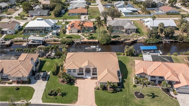 aerial view with a water view and a residential view