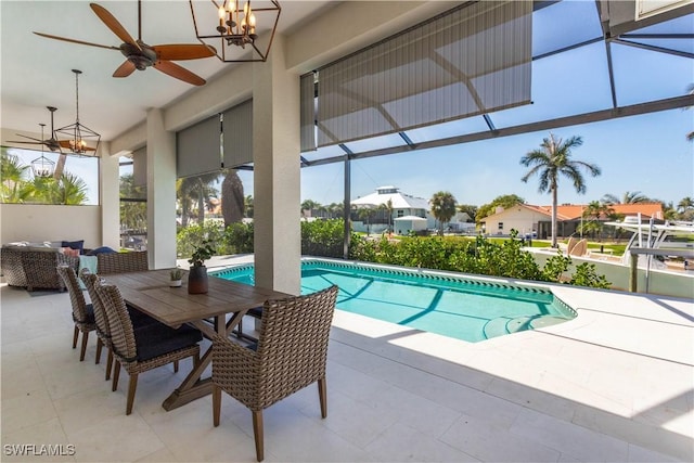 5661 Harborage Dr, Fort Myers, FL 33908 - swimming pool with a patio area, glass enclosure, and a ceiling fan