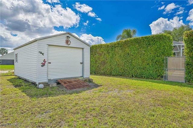 view of shed featuring fence