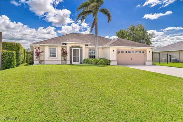 ranch-style home featuring an attached garage, central air condition unit, fence, concrete driveway, and a front lawn