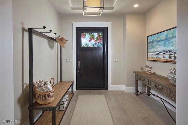 entryway featuring recessed lighting, light wood-type flooring, and baseboards