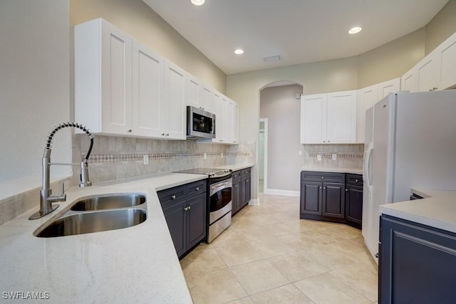 kitchen featuring sink, white cabinetry, and stainless steel appliances