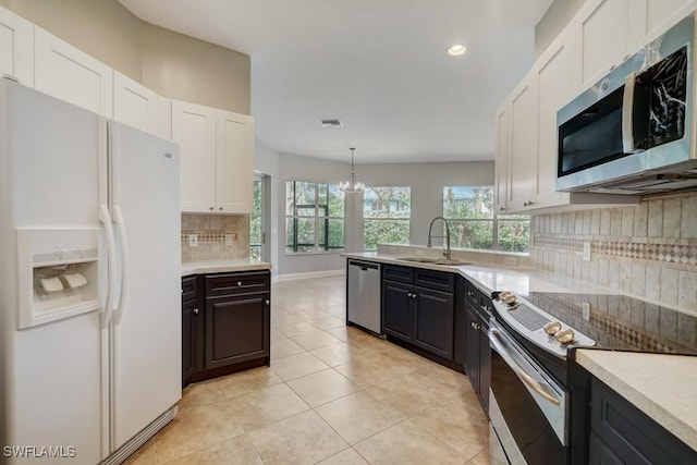 kitchen featuring sink, white cabinetry, and stainless steel appliances