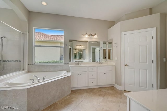 bathroom featuring separate shower and tub, tile patterned flooring, and vanity